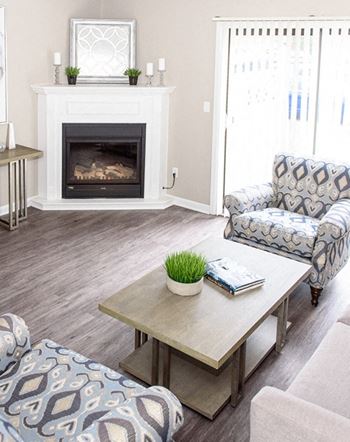Great room with fireplace (in select units)